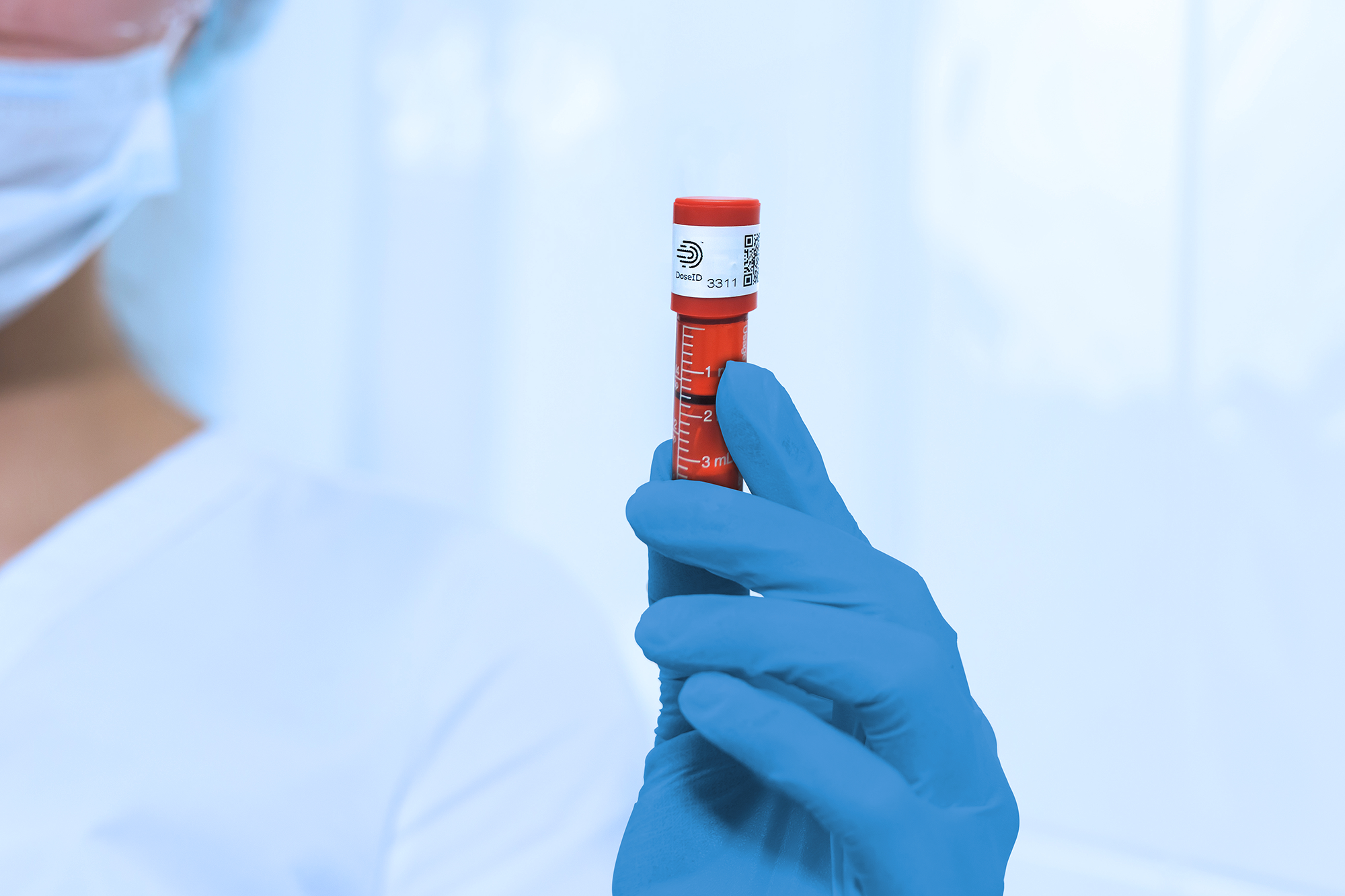 Nurse holding 57-70 RFID Cap for oral syringes
